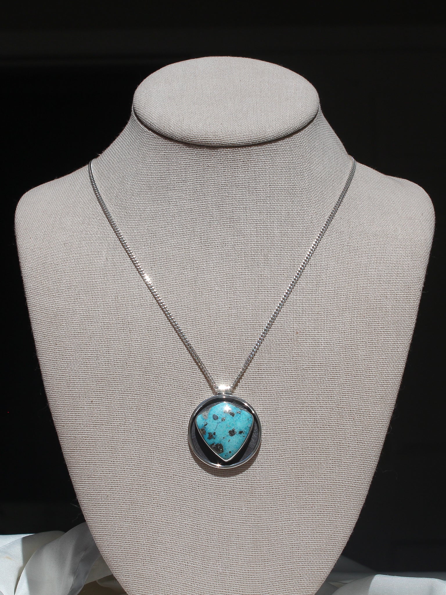 Handmade 925 sterling silver circular pendant with shield shaped white water turquoise stone with pyrite inclusions lily and William jewelry