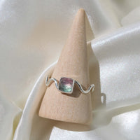 925 sterling silver funky ring with a wavy band and faceted square shaped bi-color watermelon tourmaline stone